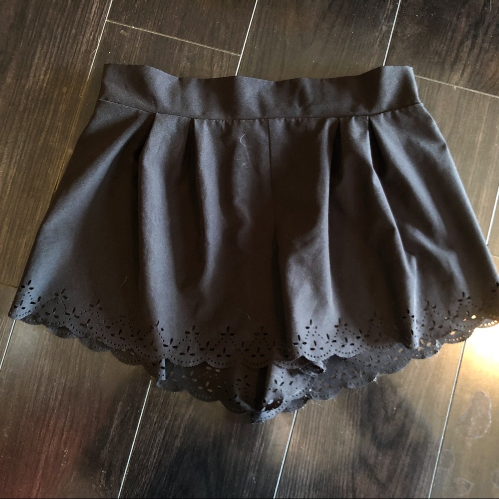 Black fashion shorts with scalloped edges